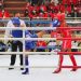 Sepakan Atlet Muay Thai Sumbar, Gilang Dwi Fajri (biru) tepat mengenai wajah atlet Kalimantan Timur Siprianus Gobang (merah) pada PON XX Papua 2021 di GOR STT GIDI, Kab Jayapura