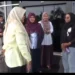 Rektor UIN IB Padang, Prof. Dr. Martin Kustati berkerudung ungu dengan baju putih menggunakan jas usai dari ruang penyidik di Kejati Sumbar, Selasa (10/2/2026)